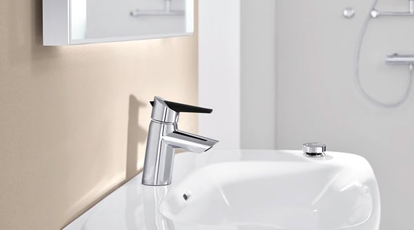 HANSAFIT washbasin faucet has a handy eco button that limits water flow and temperature. The limit can be bypassed by pushing the button. 