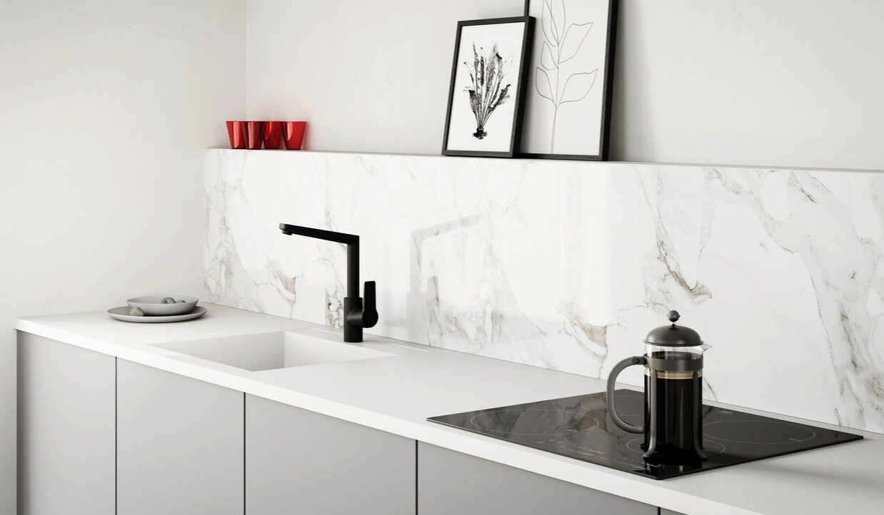 Black HANSATWIST kitchen faucet with ceramic coating in a white kitchen.