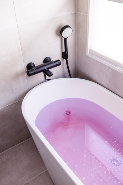 A bathtub with a faucet

Description automatically generated with medium confidence